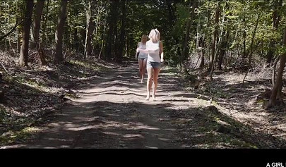 Sweet lesbian hotties kissing and rubbing clit in the woods