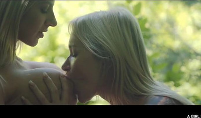 Sweet lesbian hotties kissing and rubbing clit in the woods