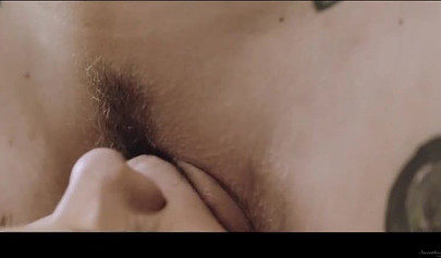 Blonde lesbian enjoying sex with her brunette girlfriend