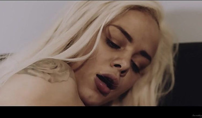 Blonde lesbian enjoying sex with her brunette girlfriend