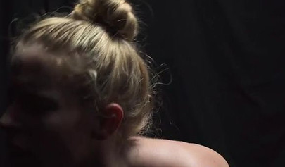 Beautiful busty girls enjoy facesitting in a dark room