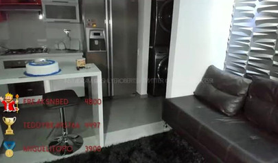 Naked chicks posing on a balcony overlooking the city