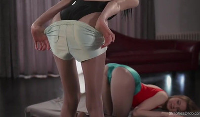 Beautiful lesbians in swimsuits tribbing in the bedroom