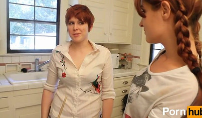 Redhead cuties finger each other in the kitchen