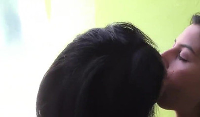 Brazilian lesbian kiss of two beauties by the pool