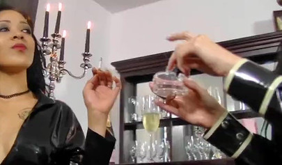 Smoking girls in latex outfit enjoying strap-on sex