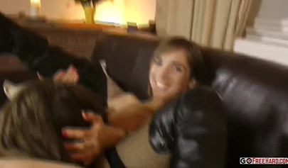 Two girls in sexy stockings making love on the couch