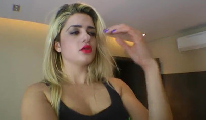 Blonde mistress practices foot fetish and face trampling