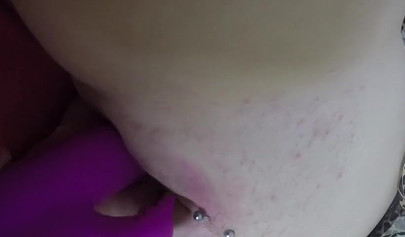 Busty blonde satisfies a tied up brunette on the bed