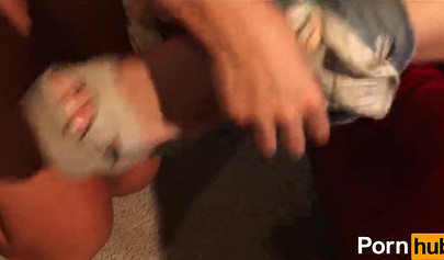 Horny lesbian sisters enjoy scissoring on a red couch