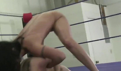 Amazing naked girls fighting with a purple dildo in the ring