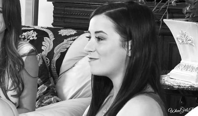 Redhead girl is satisfying a busty brunette in the bedroom