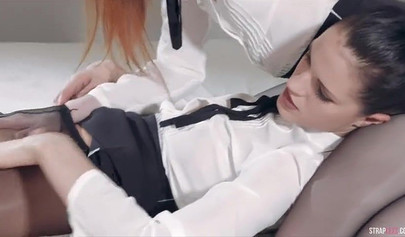 Amazing girls enjoy strap-on sex in office uniforms