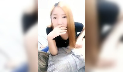 Chinese girl makes her masked slave lick her toes in homemade video