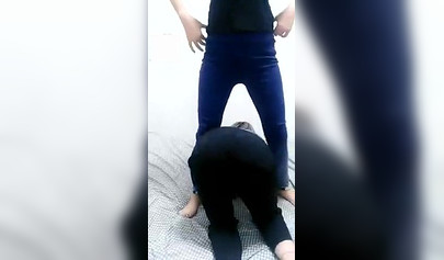 Chinese girl makes her masked slave lick her toes in homemade video